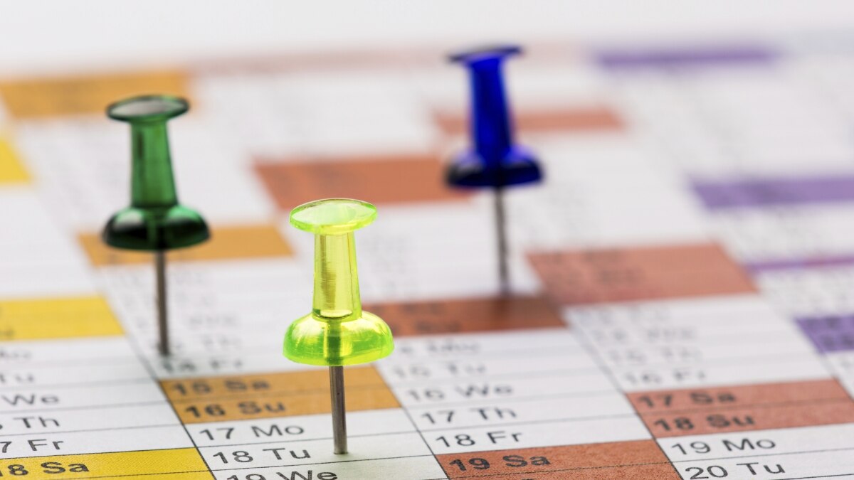 Pushpins on a calendar
