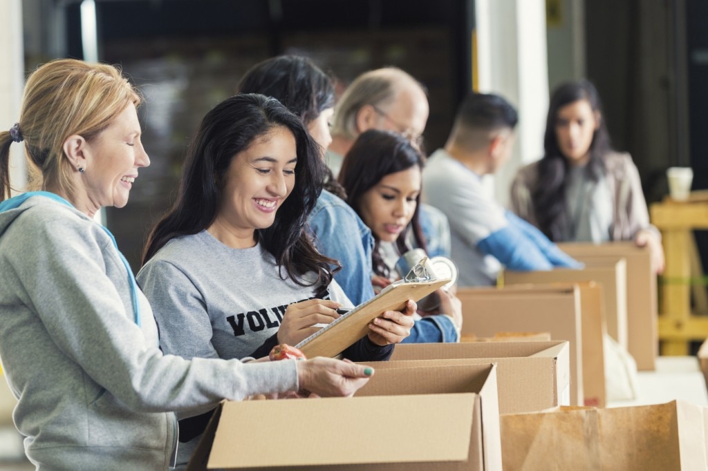 People filling boxes for donations
