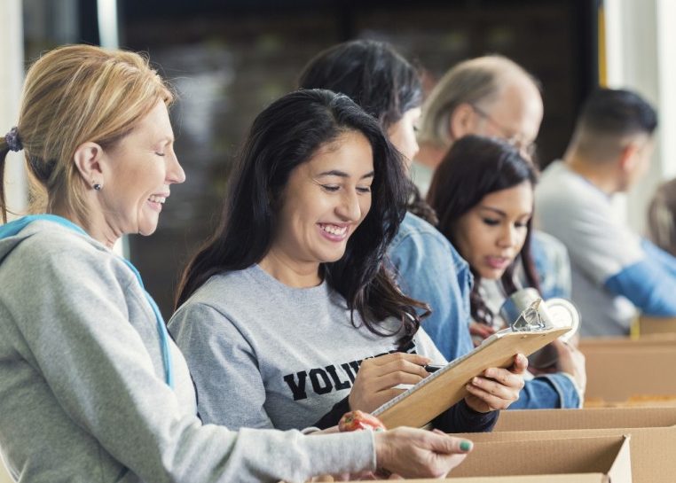 People filling boxes for donations