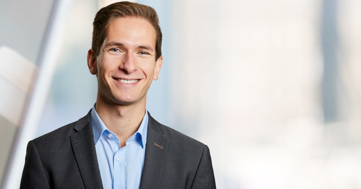 Professional headshot of a man in a suit