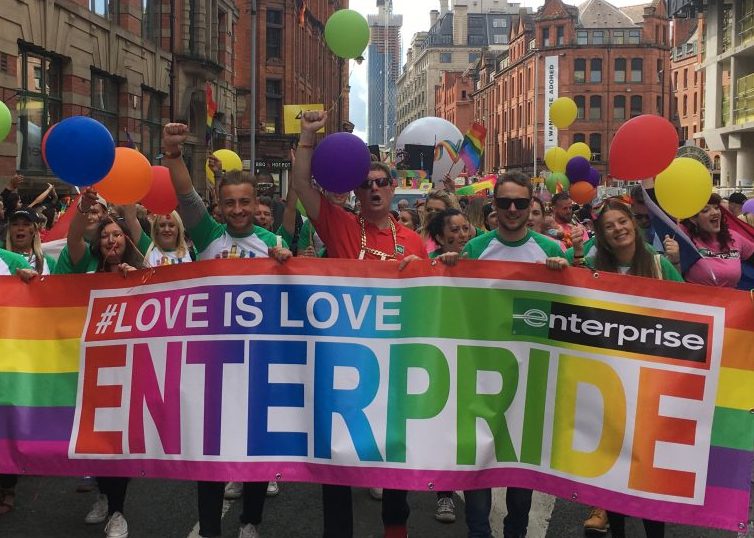 Enterprise employees holding the "Enterpride" banner at the Pride parade