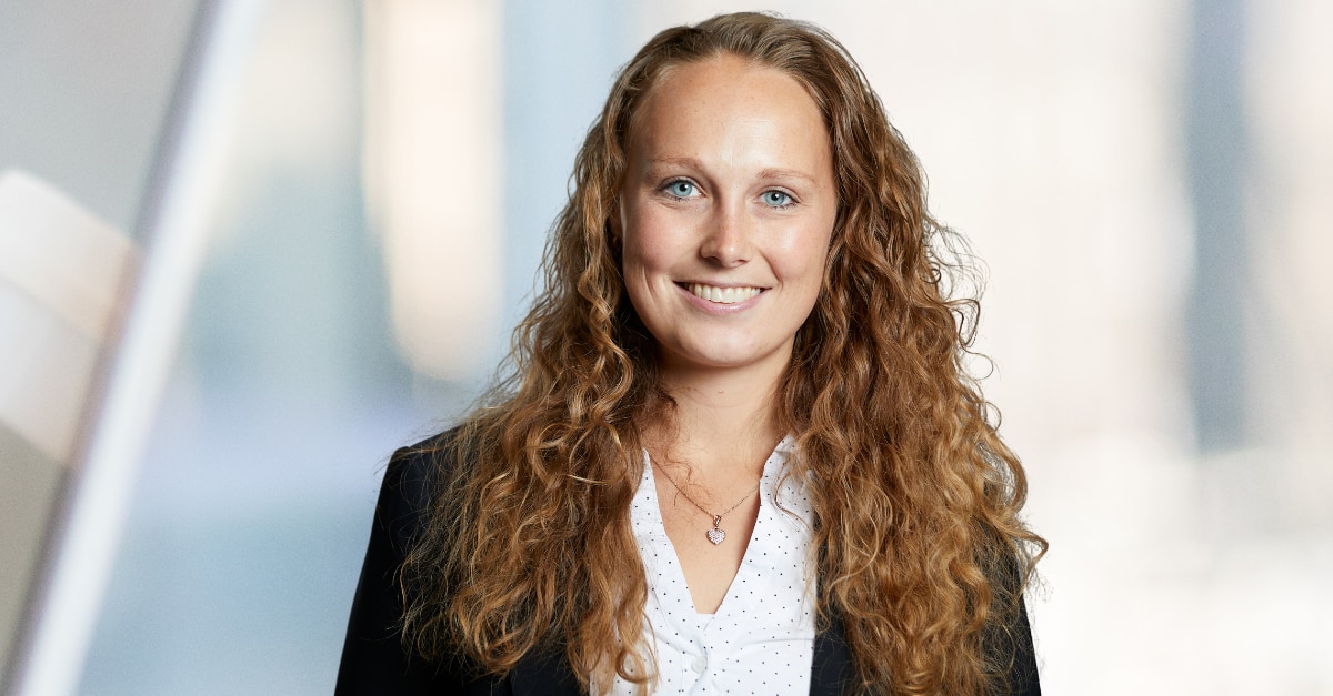 Professional photo of woman with long curly hair in a blazer