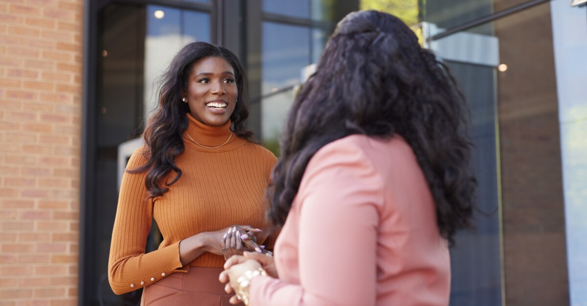 Enterprise Mobility members talking outside a career fair