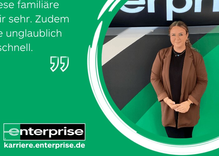 Girl in blazer standing in front of Enterprise sign with quote on green background