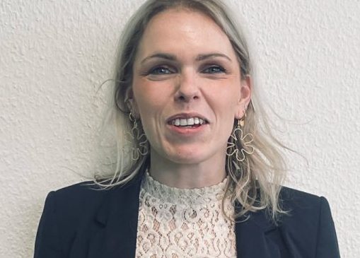 Headshot of female in business attire with a quote