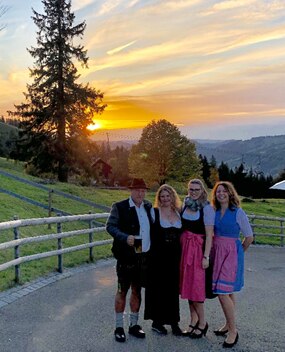 Employee group photo at sunset