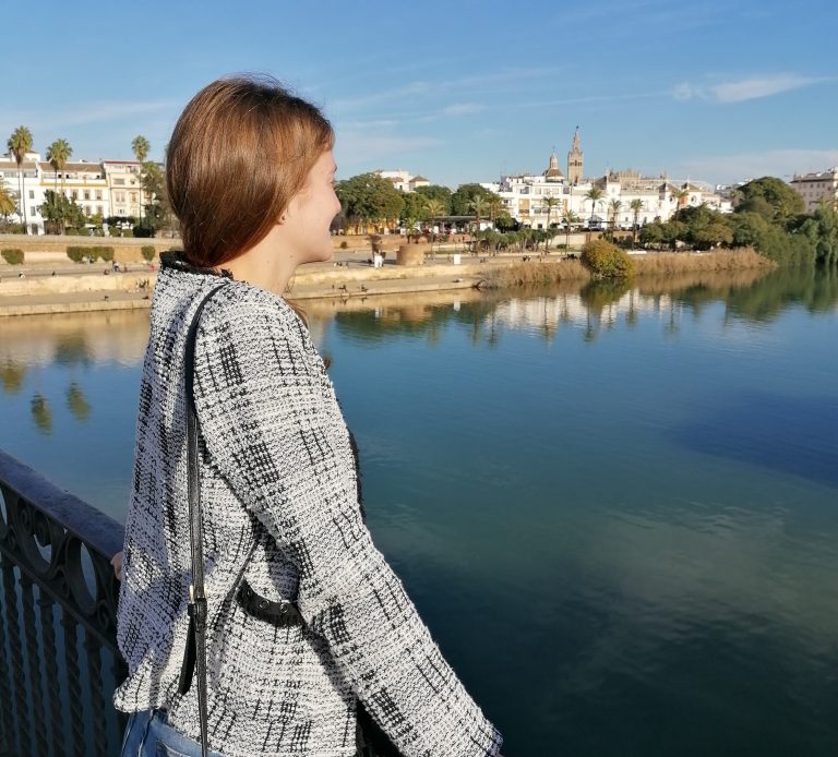 Girl overlooking a body of water